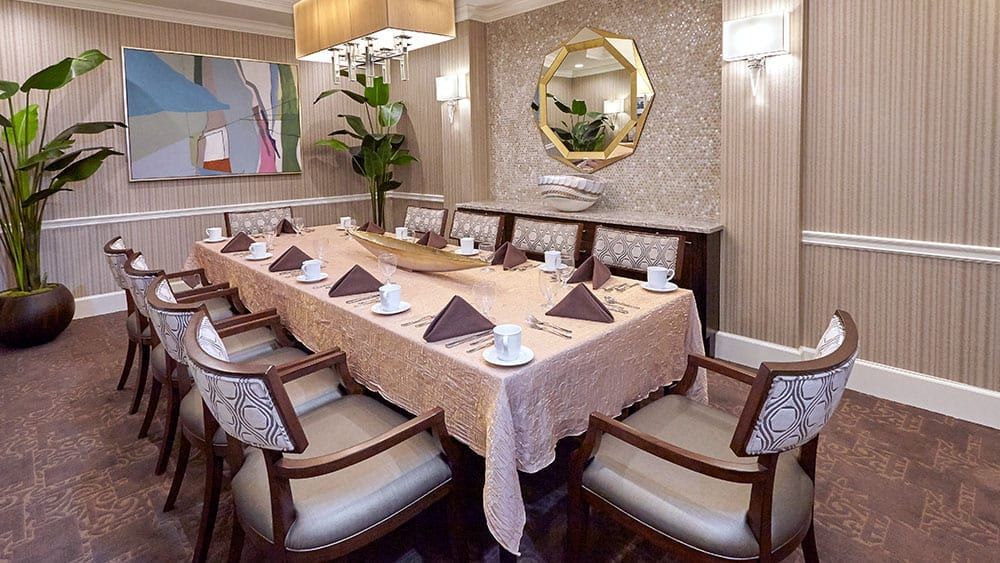 Senior living community, The Bristal At Wayne, featuring dining room with elegant furniture and decor.