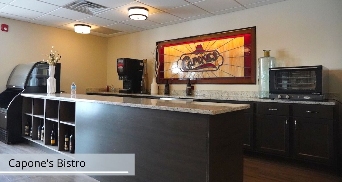 Interior view of Valparaiso Senior Village featuring modern kitchen appliances and electronics.