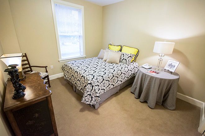Senior living bedroom at Brookdale Green Hills Cumberland with cozy furniture and decor.