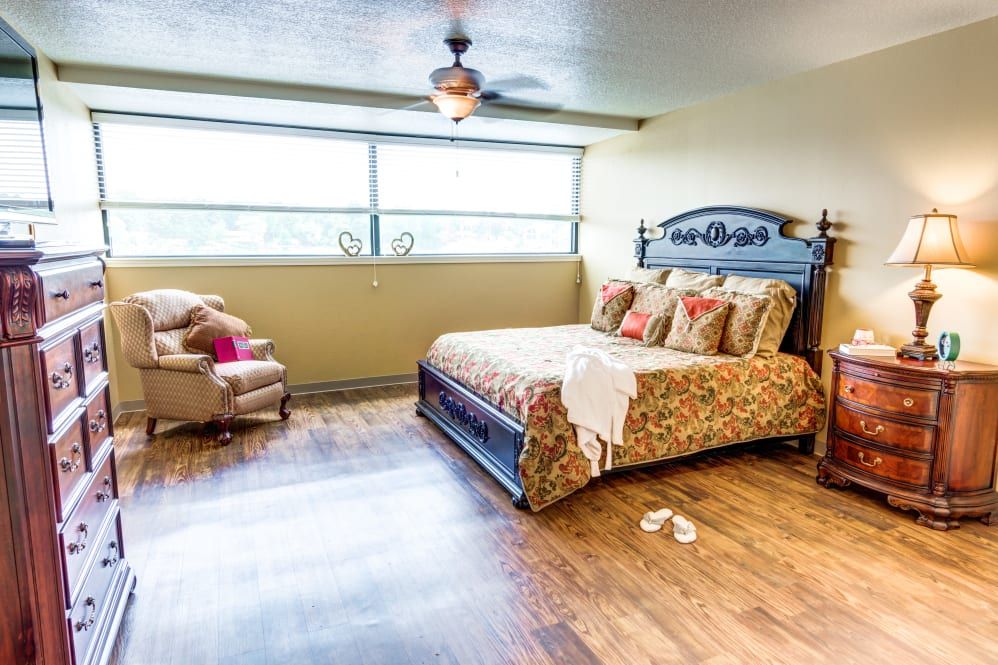 Interior view of a bedroom at The Atrium at Serenity Pointe senior living community.