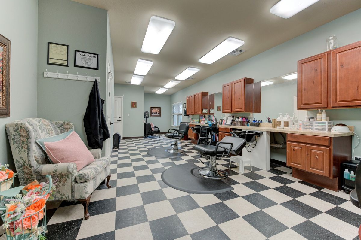 Senior living community Arabella of Athens featuring an indoor barbershop, beauty salon, and art paintings.