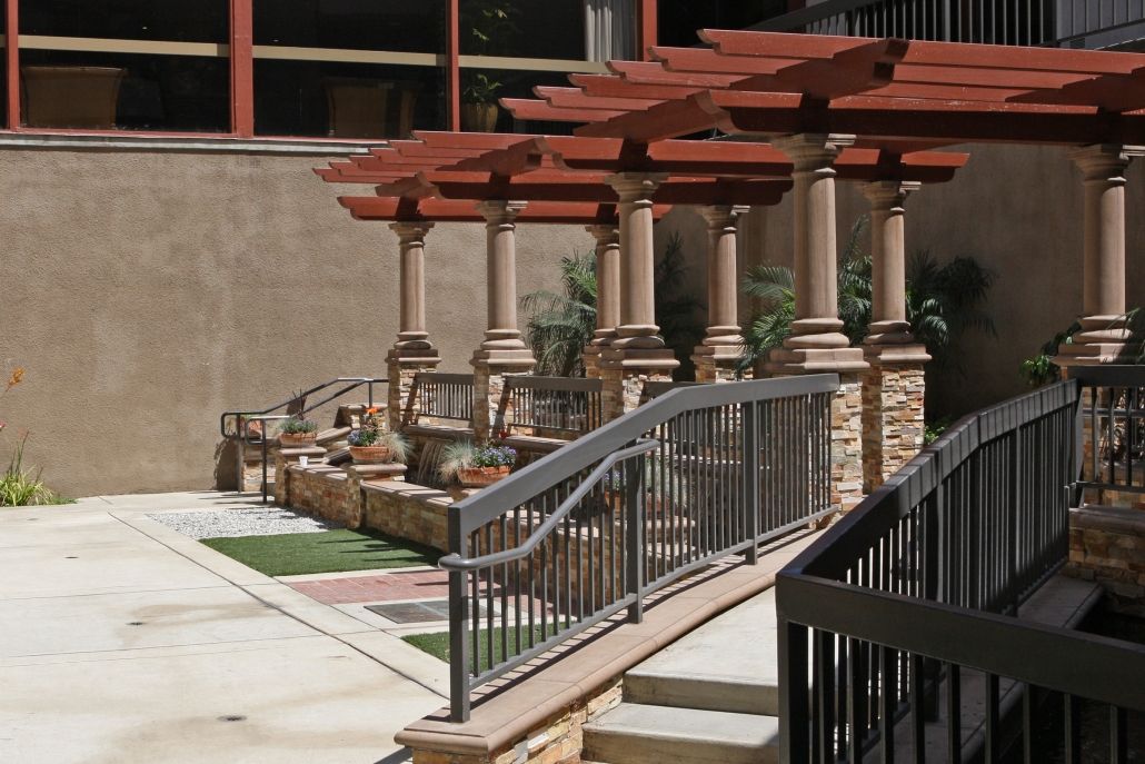 Southland Care Center, a senior living community featuring a house with porch, patio, pergola, and walkway.