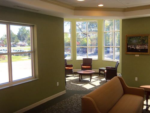 Interior view of Manoogian Manor senior living community featuring cozy furniture and large picture window.