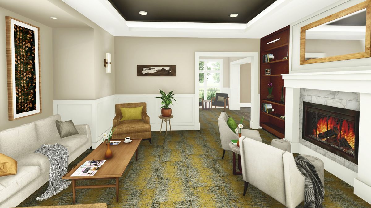 Interior view of Tiffany Springs Senior Living room with modern decor, furniture, and fireplace.