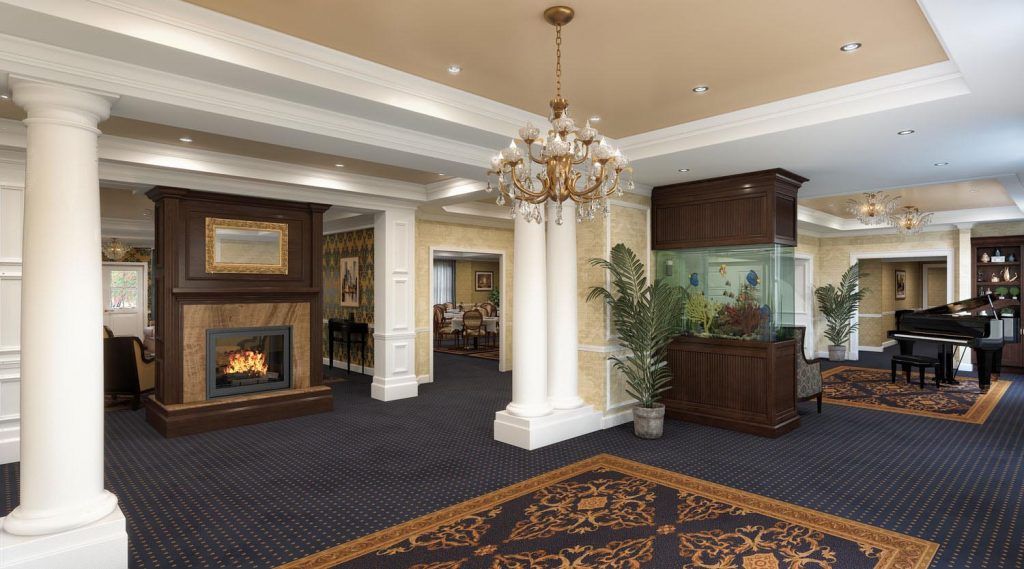 Interior of Brandywine Living At Summit featuring a piano, chandelier, and cozy fireplace.