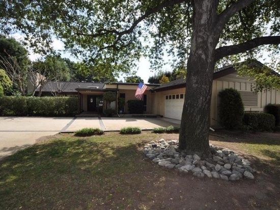 Adora Hills Lone Hill senior living community with lush vegetation and modern architecture.