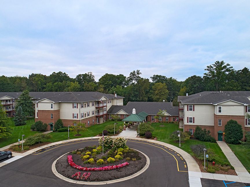 Senior living community, American House Riverview, featuring modern architecture in an urban setting.