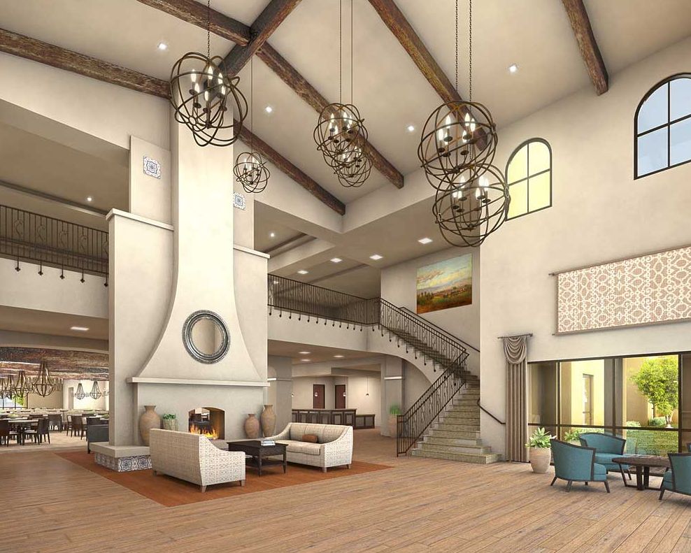 Interior view of The Villas At Stanford Ranch senior living community featuring a grand staircase.
