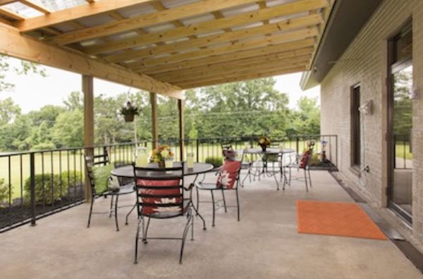 Stella Manor Nursing and Rehabilitation Center featuring indoor and outdoor living spaces.