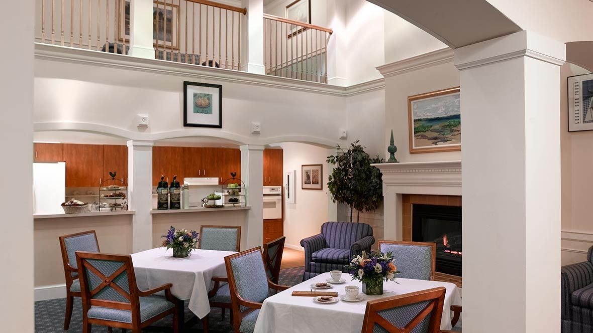 Interior view of Atria Marina Place senior living community featuring elegant dining and living areas.