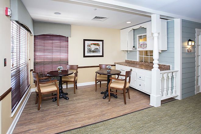 Interior view of Brookdale Roanoke senior living community featuring dining room, kitchen, and decor.