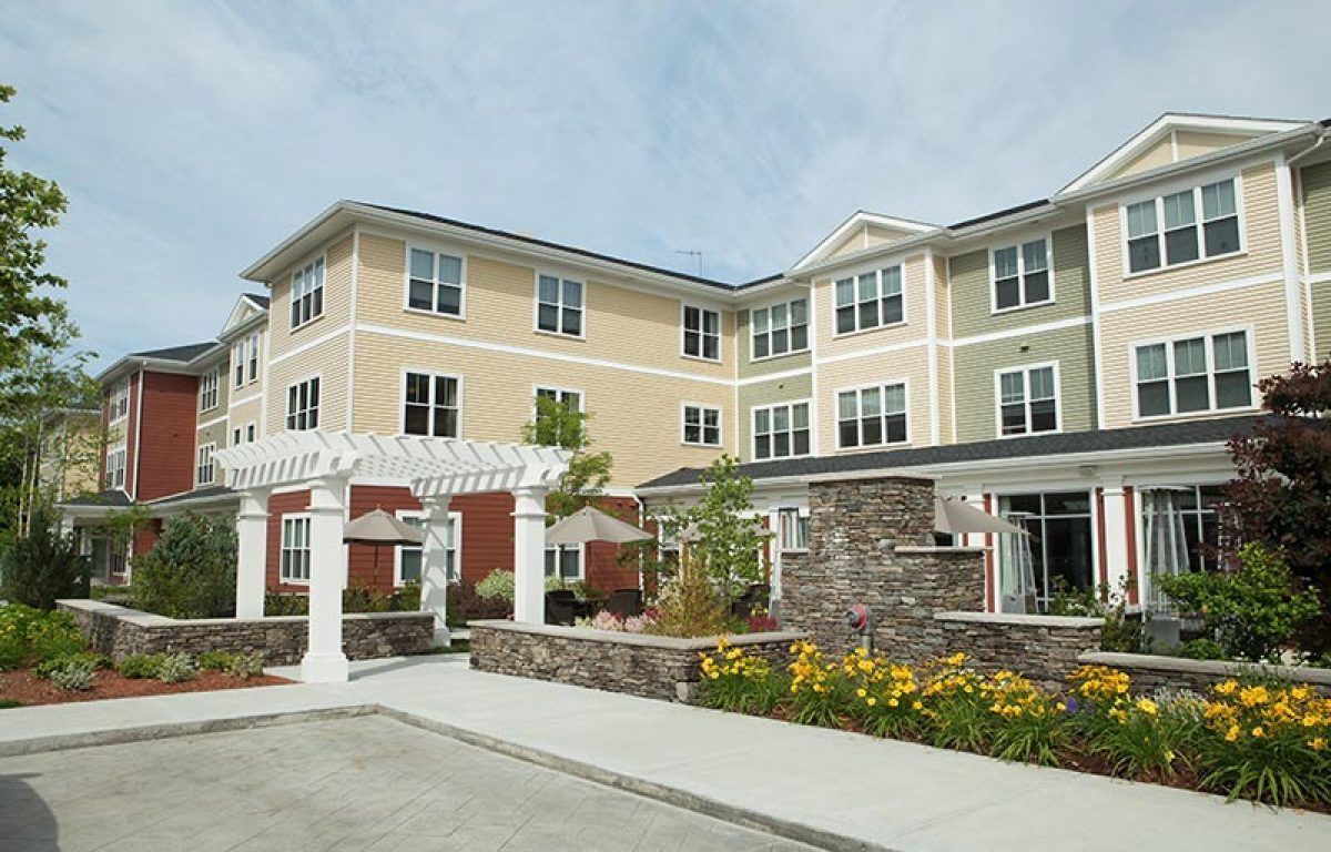 Modern architecture of Wingate Residences, a senior living condo in a suburban neighborhood in Needham.