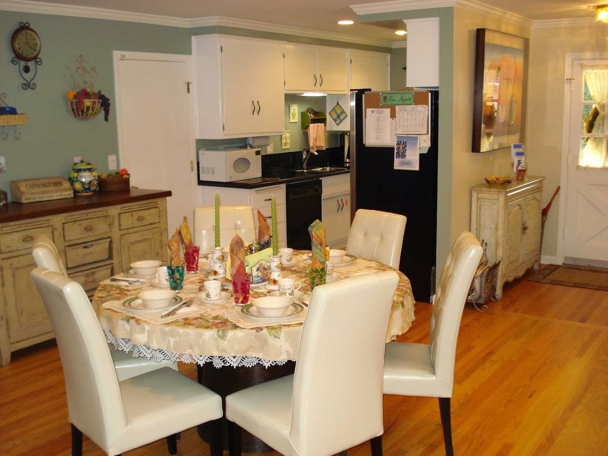 Interior view of a senior living community featuring a well-equipped kitchen and dining area.