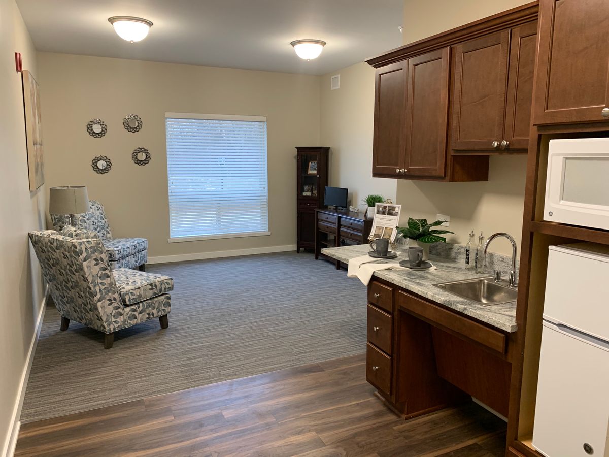 The bright and spacious living area of our 1-bedroom assisted living suite