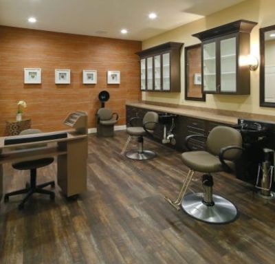 Indoor view of The Heritage at Hunters Chase senior living community featuring a barbershop and beauty salon.
