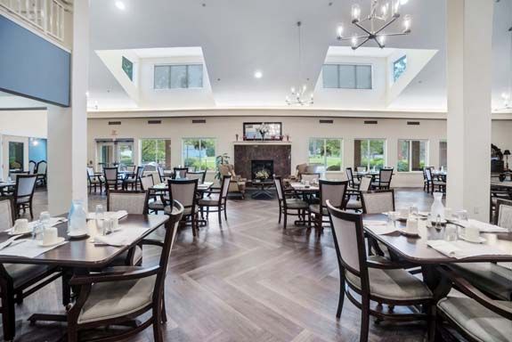 Interior view of Rittenhouse Village Gahanna's dining area featuring elegant architecture and furniture.