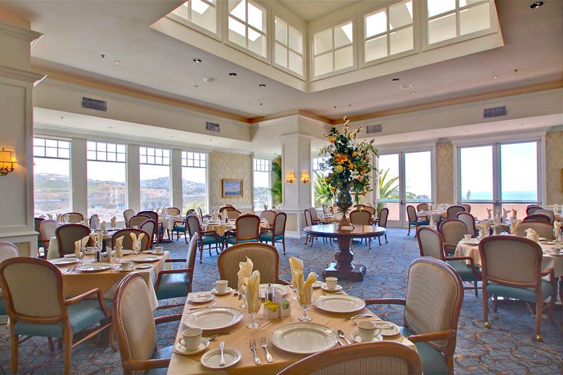 Senior living community dining room at The Fountains At Sea Bluffs with coffee and decor.