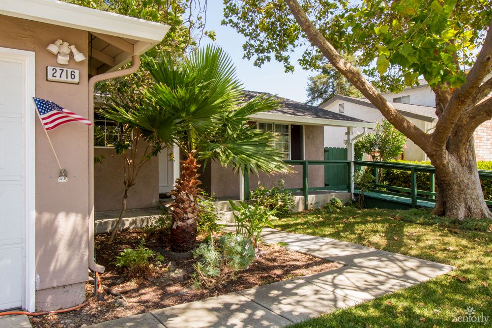 Summer view of Path Walkway at Ageway Boarding Care, a senior living community with lush nature.