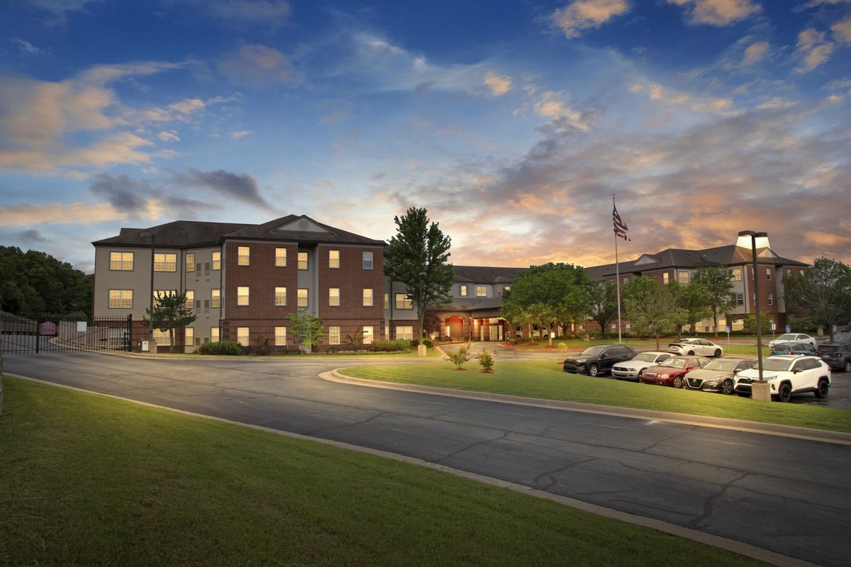 Senior living community in Tulsa with lush lawns, modern condos, and active residents.