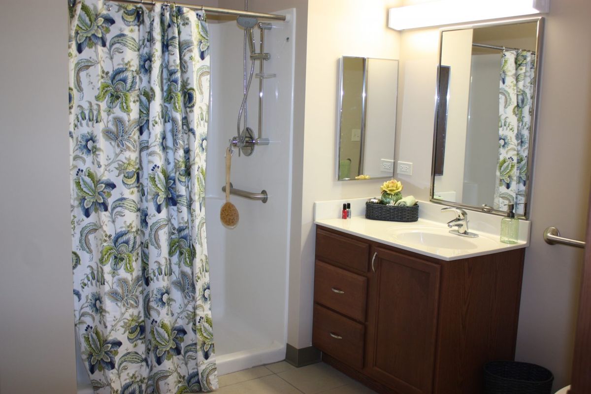 Senior living bathroom with sink and faucet at Montclare Supportive Living community.