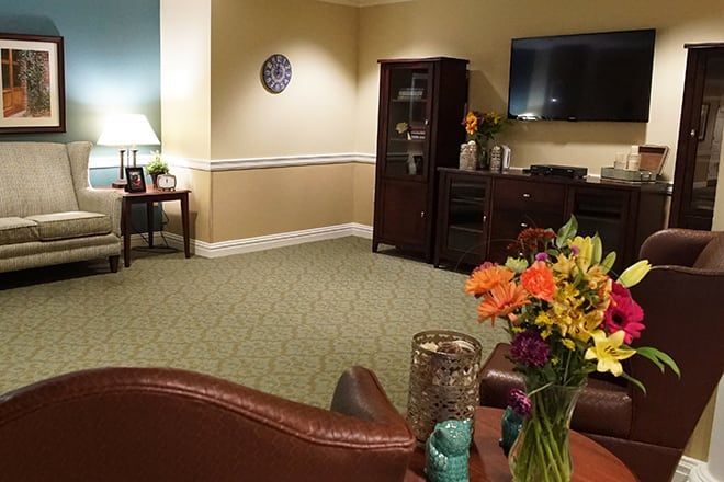 Interior view of Brookdale Florham Park senior living room with modern electronics and decor.
