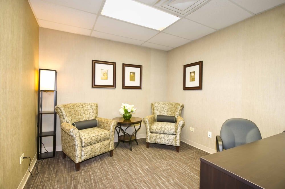 Senior living community reception room at Aperion Care International with art and decor.