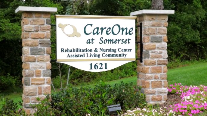 CareOne at Somerset Valley senior living community with lush gardens, walking paths, and buildings.