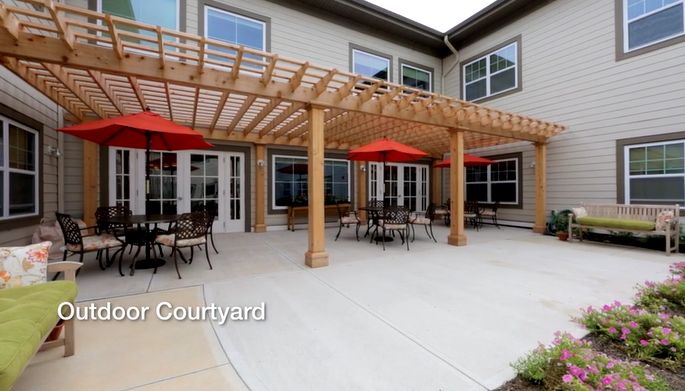 Senior living community, CareOne at Somerset Valley, featuring housing with patios, decks, and pergolas.