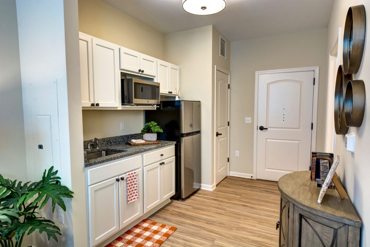 Interior view of a well-equipped kitchen in Palos Heights Senior Living community.