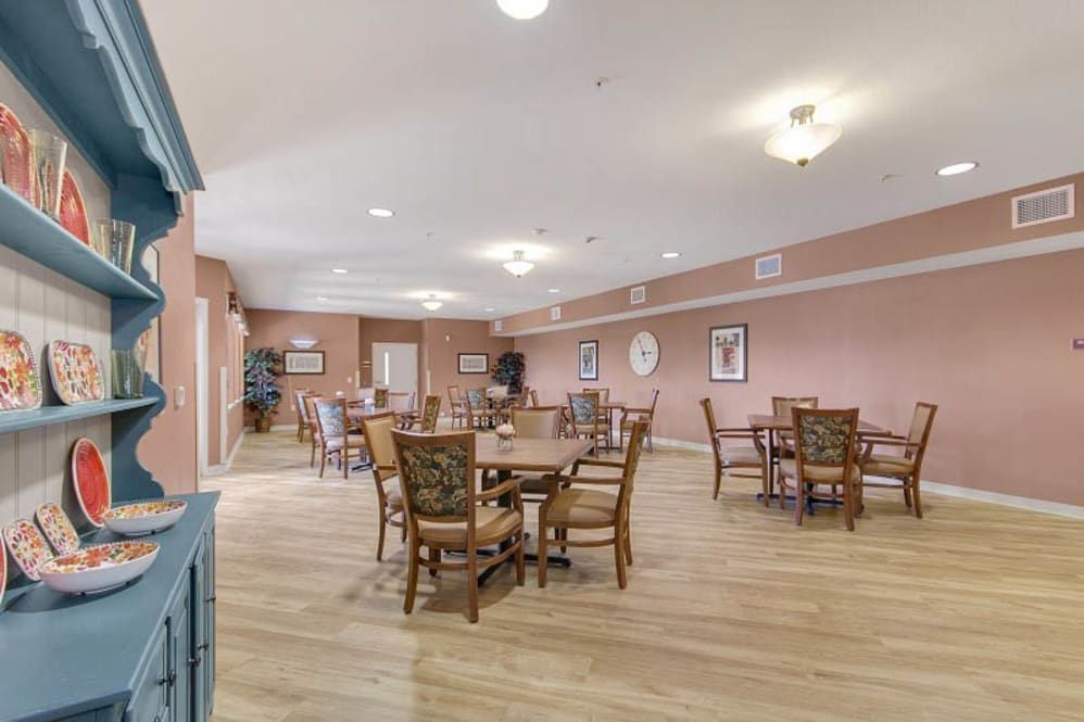 Interior view of The Pines, a Merrill Gardens senior living community, showcasing dining area and decor.