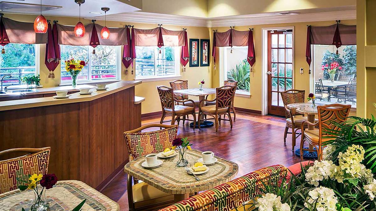 Interior view of Atria Carmichael Oaks senior living community featuring dining room decor.