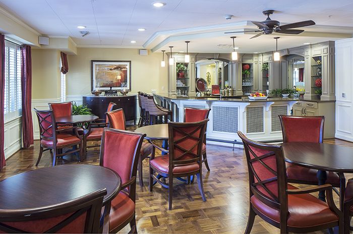 Interior view of Brightview Fallsgrove senior living community featuring dining area and modern amenities.