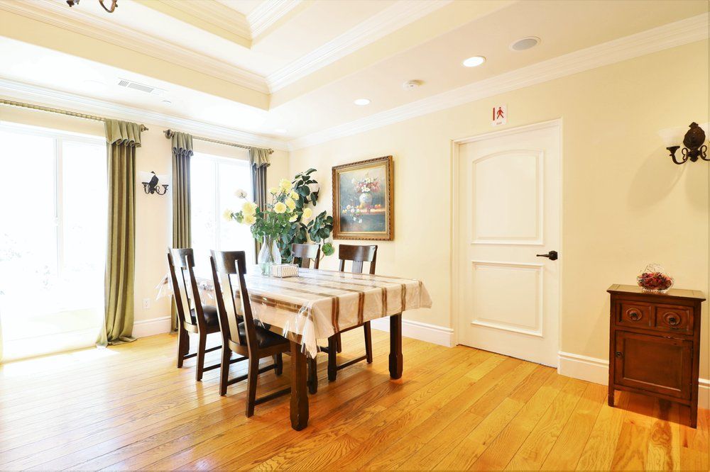 Architecturally stunning Astoria Retirement Residence featuring hardwood dining room with elegant decor.