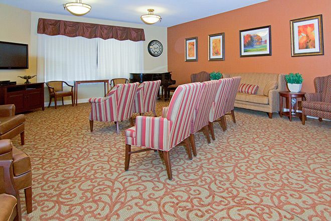 Interior view of Summit Assisted Living in Tarzana featuring modern decor, electronics, and furniture.