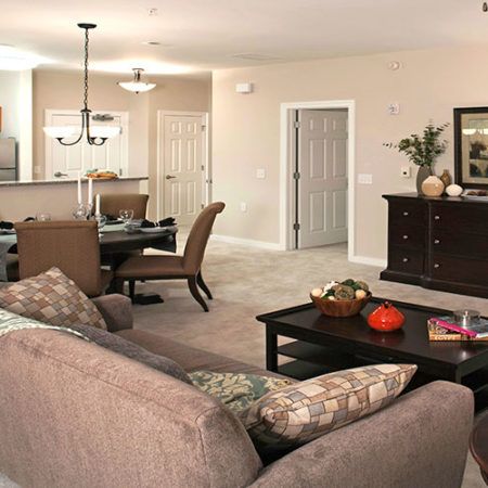 Interior view of Danberry At Inverness senior living community featuring elegant dining and living room decor.