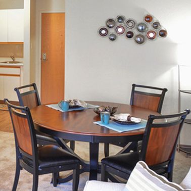Senior living community Heritage Oaks' architectural building with furnished dining room indoors.