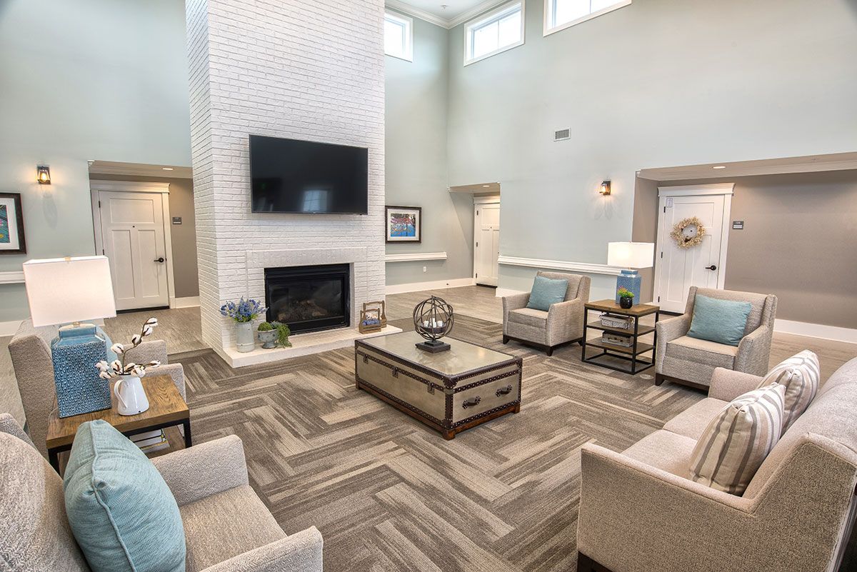 Interior view of Dominion Senior Living Of Athens featuring modern decor, furniture, and electronics.