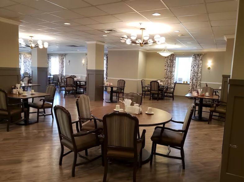 Interior view of The Pointe at Eastgate senior living community featuring dining area and lounge.