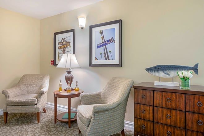 Senior living room at Brookdale Santa Monica Gardens with art, sea life painting, and home decor.
