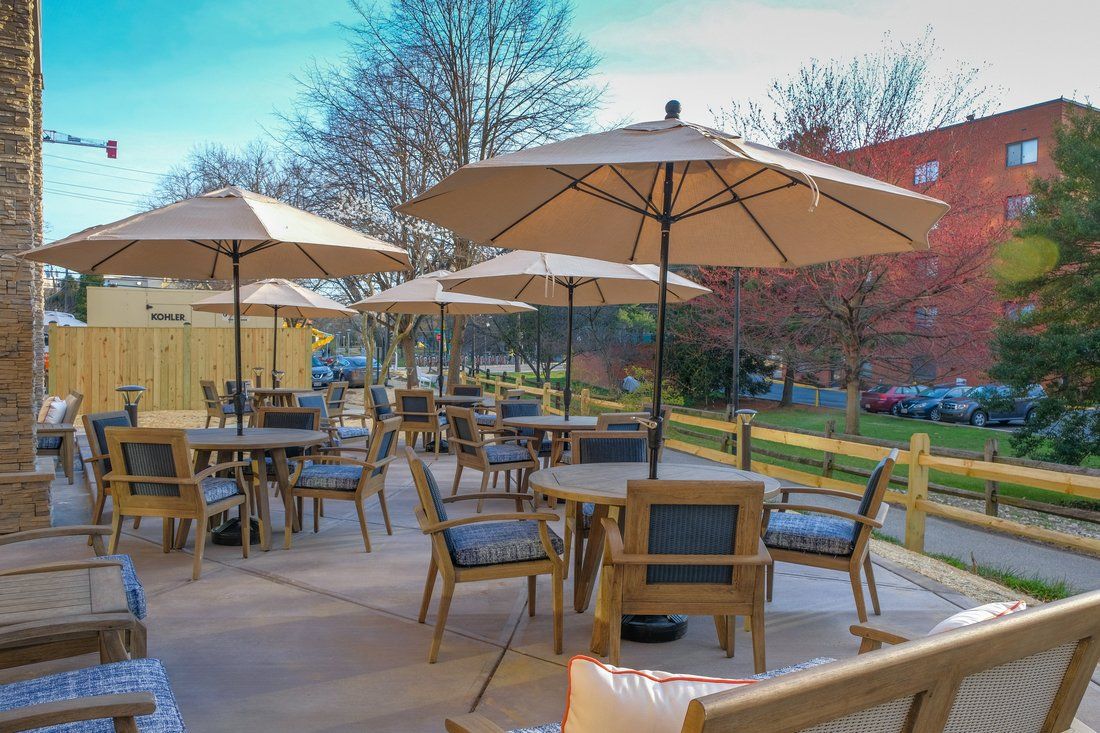 Dining area in Sunrise of Bethesda senior living community with urban construction view.