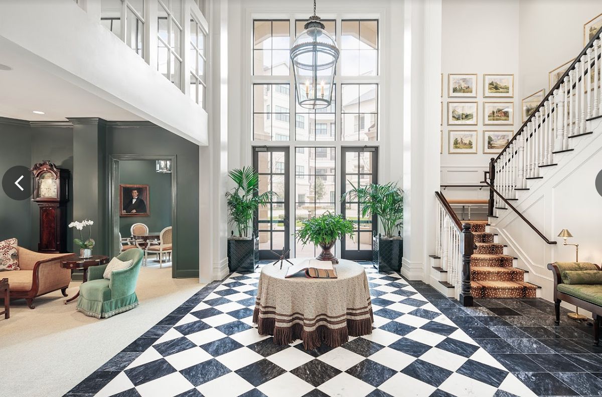 Senior living community foyer with modern architecture, art paintings, and home decor.