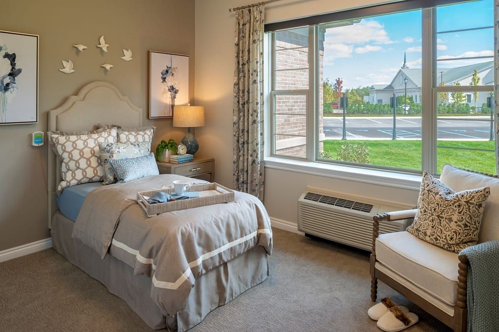 Interior view of Blossom Springs senior living community featuring cozy decor, furniture, and art.