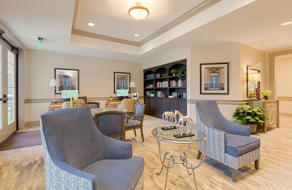 Interior view of The Enclave at Cedar Park Senior Living featuring modern decor and furniture.