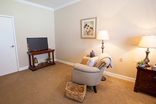 Interior view of Brookdale Sugar Land senior living community featuring modern furniture and electronics.