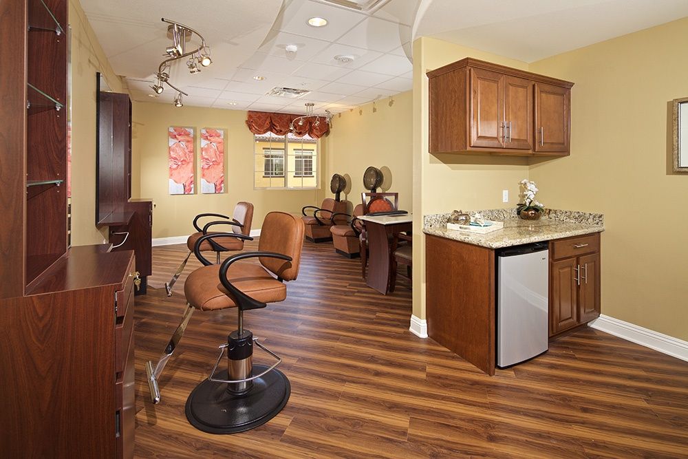 Indoor view of Felicita Vida senior living community featuring furniture, beauty salon, and appliances.