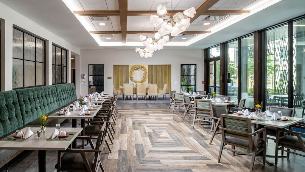 Interior view of Thrive at Montvale senior living community featuring dining room and lounge.