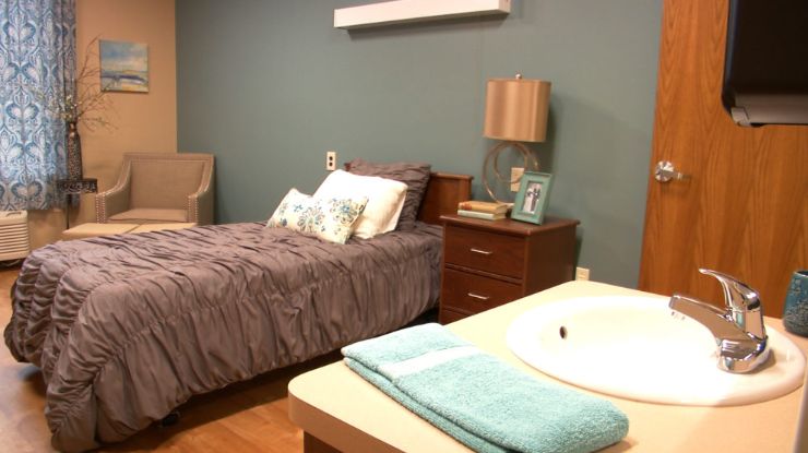Interior view of a furnished bedroom in Belmar Oakland senior living community.