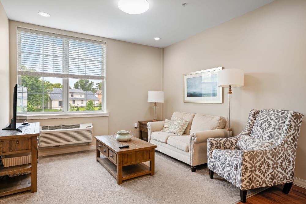 Senior living room interior at Anthology Of Overland Park with modern decor and furniture.