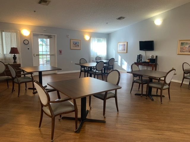 Interior view of Rosecastle At Delaney Creek senior living community's dining area with modern amenities.