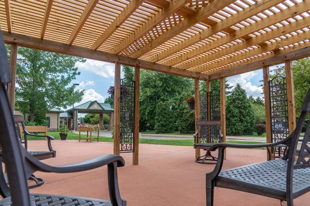 Senior living community in Maple Heights featuring indoor and outdoor spaces with lush greenery.